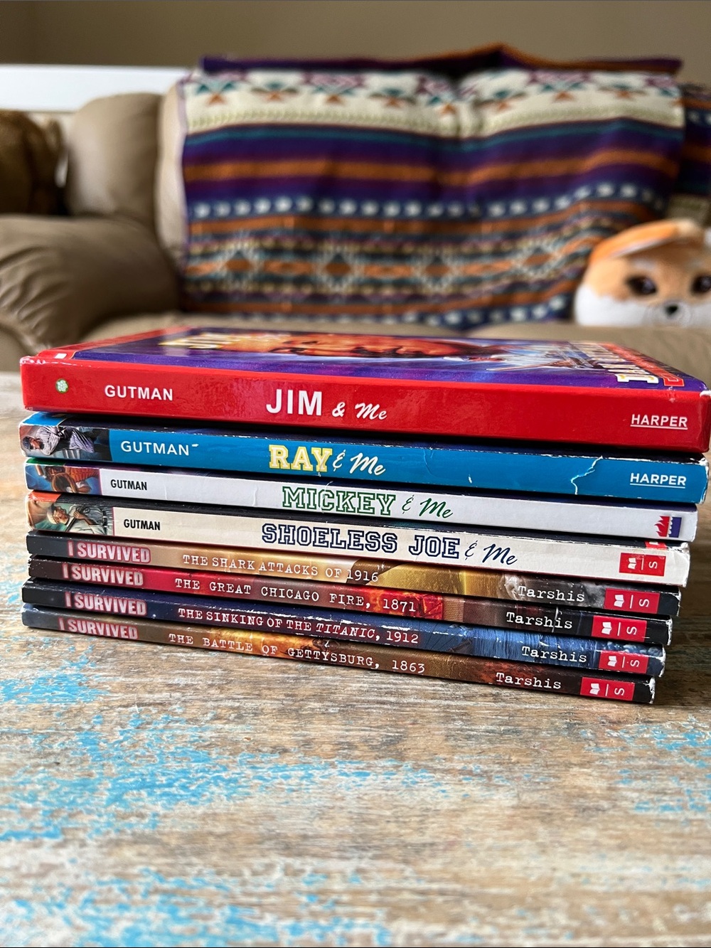 Stack of Children's Books - Colorful Spines (Red, Blue, White, Black, Brown)